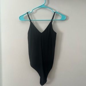 Plain black ribbed body suit never worn